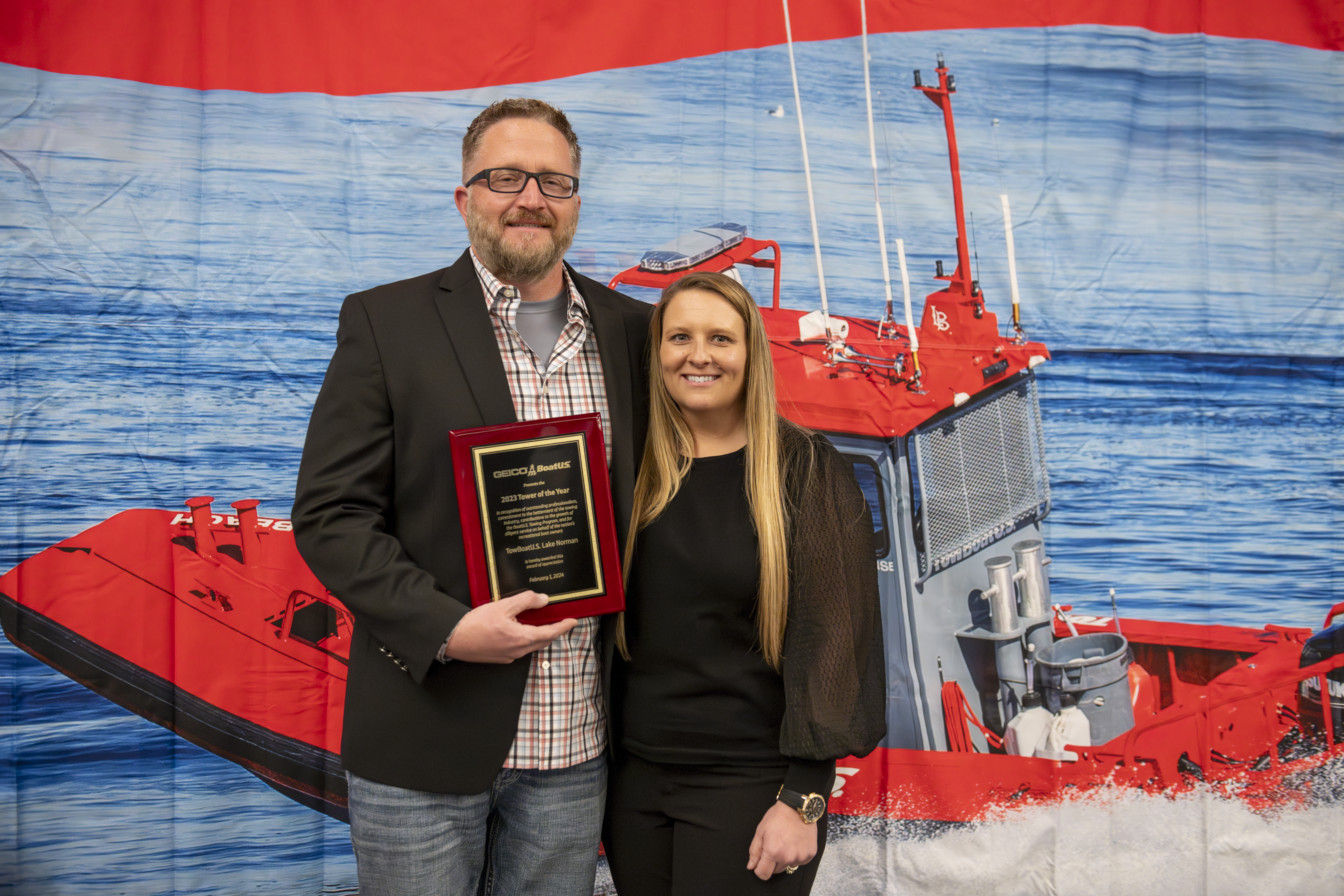 Capt. Derek Debord and his wife, Cheryl, accept the coveted TowBoatUS Tower of the Year Award at the 2024 TowBoatUS Conference in Savannah, Georgia. (credit: Stacey Nedrow-Wigmore/BoatUS)